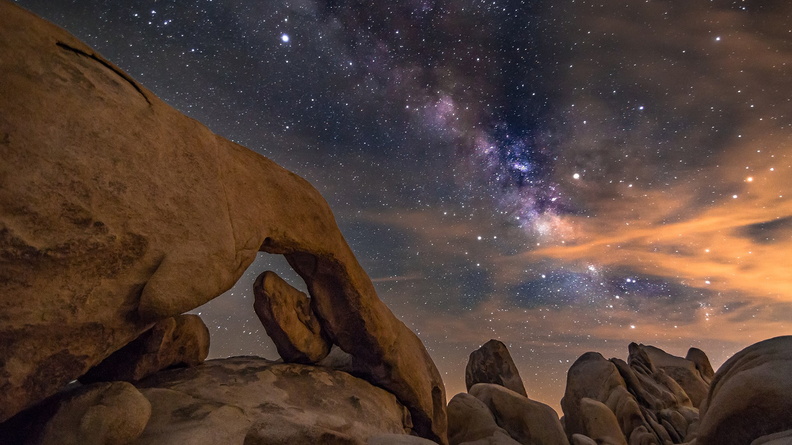 Starry sky above canyon rocks